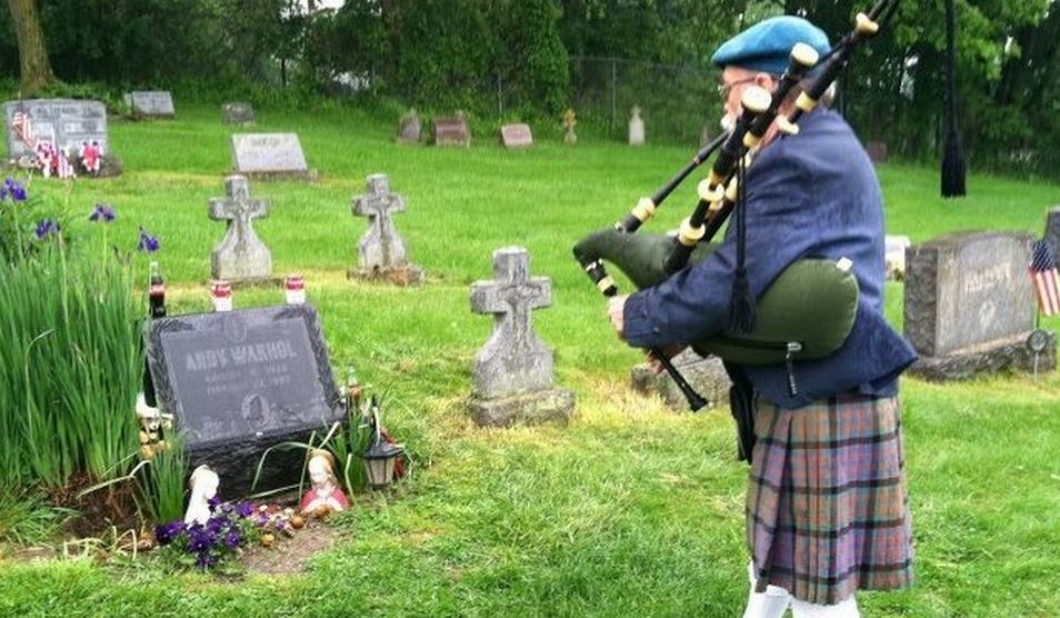 Did this Bagpiper outdo himself at this funeral?